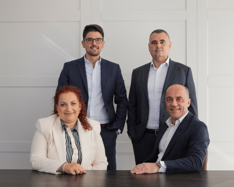 A2CO's Partner and Directors posing and looking at the camera including Clinton Cutajar, Anton Dalli, Antoinette Scerri, and Oliver Zammit.