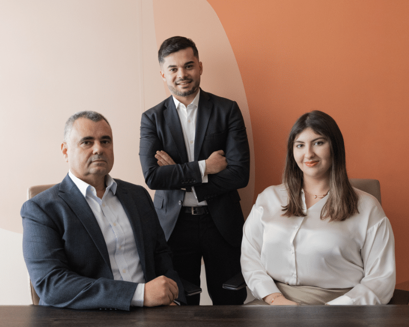 A2CO Technologies team smiling at the camera including Partner Anton Dalli, Advisor Stephen Tonna and Junior Advisor Kate Taliana Gatt