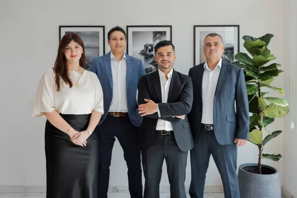Anton Dalli, Partner at A2CO, seated with Stephen Tonna, Mark Vella and Kate Taliana Gatt in the firm's Malta office, part of the team advising MGA licence holders on gaming compliance and audit readiness.